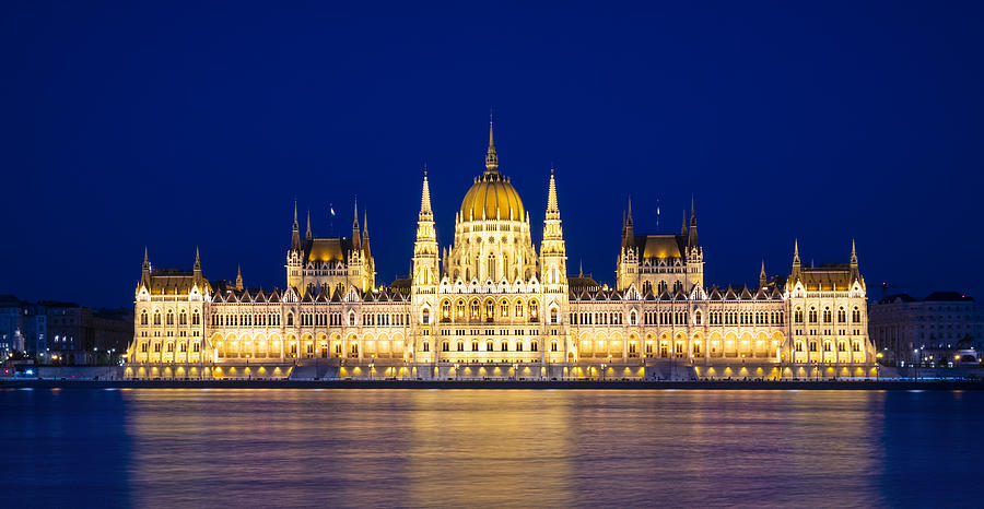 The Hungarian Parliament floodlit at night, viewed across the Danube from the Buda side